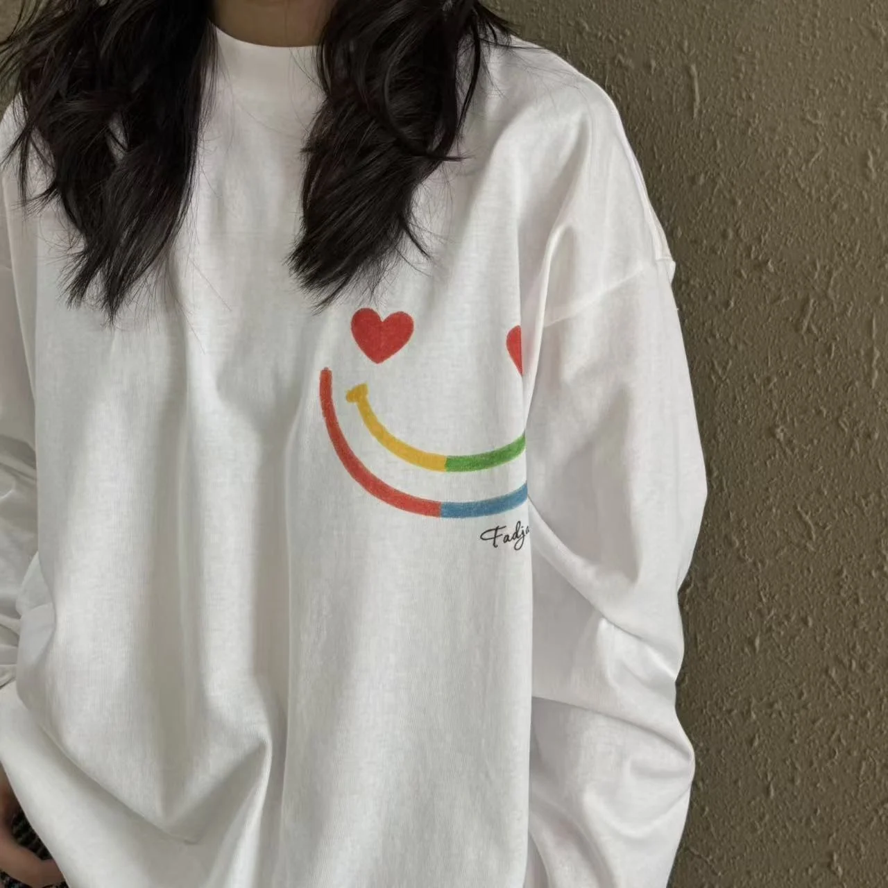 Heart-shaped eyes and rainbow smile